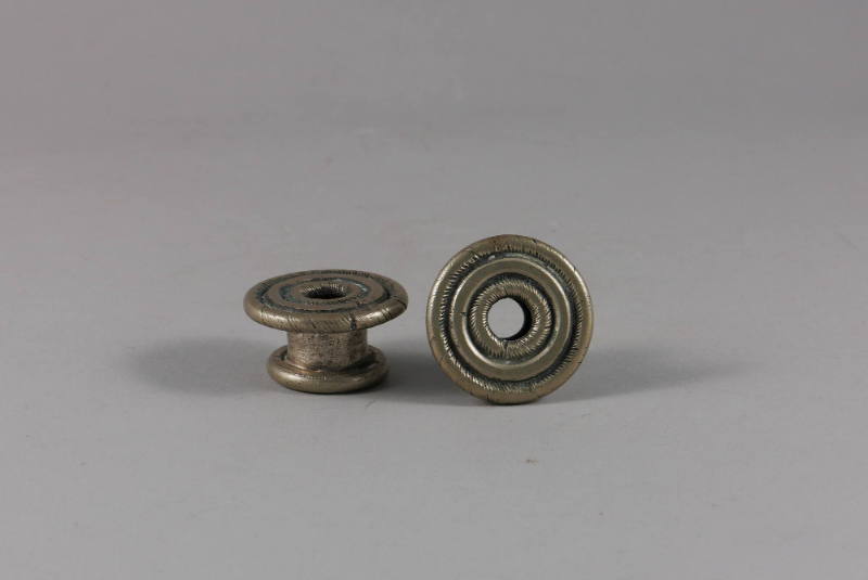 Ear Spools, 20th Century
Miao culture; probably Guizhou Province, China
Silver; 5/8 × 1 1/4 i…