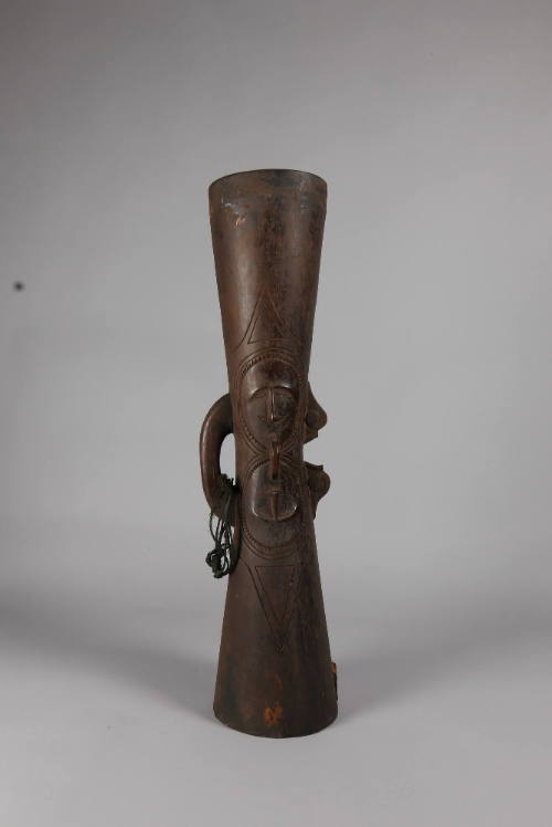 Drum (Kundu), 20th Century
Papua New Guinea, Melanesia
Wood and fiber; 29 3/4 × 7 × 6 5/8 in.…