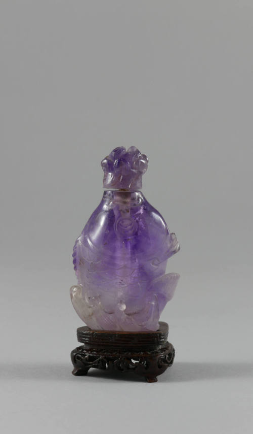 Fish-Shaped Snuff Bottle, late 20th century
China
Amethyst, wood, and cork; 2 1/2 × 1 1/2 × 1…