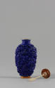 Blue Snuff Bottle with Molded Phoenix and Dragon Design, Qing dynasty (1644-1911)
China
Porce…