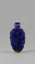 Blue Snuff Bottle with Molded Phoenix and Dragon Design, Qing dynasty (1644-1911)
China
Porce…