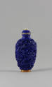 Blue Snuff Bottle with Molded Phoenix and Dragon Design, Qing dynasty (1644-1911)
China
Porce…