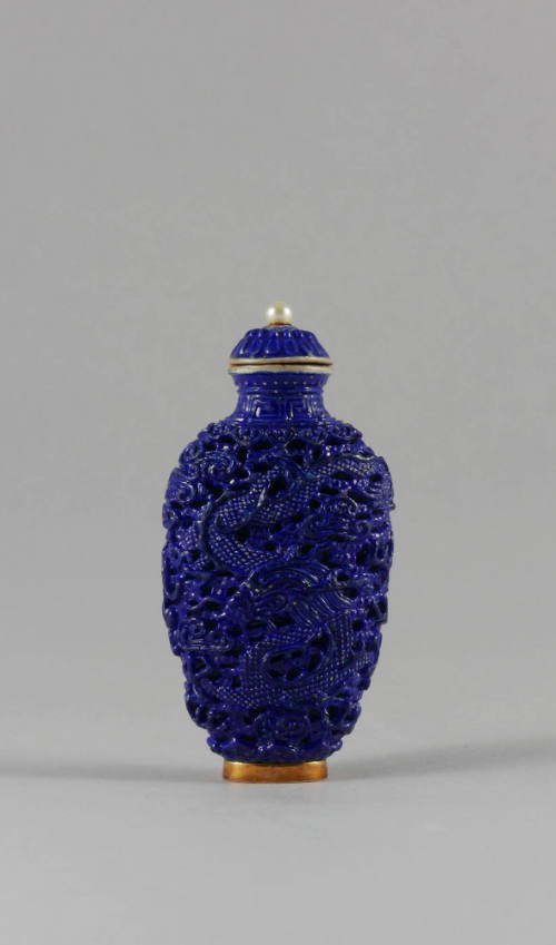 Blue Snuff Bottle with Molded Phoenix and Dragon Design, Qing dynasty (1644-1911)
China
Porce…