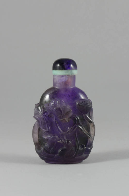 Carved Purple Snuff Bottle, early 20th century
China
Fluorite and jade; 3 1/8 × 1 7/8 × 1 1/4…