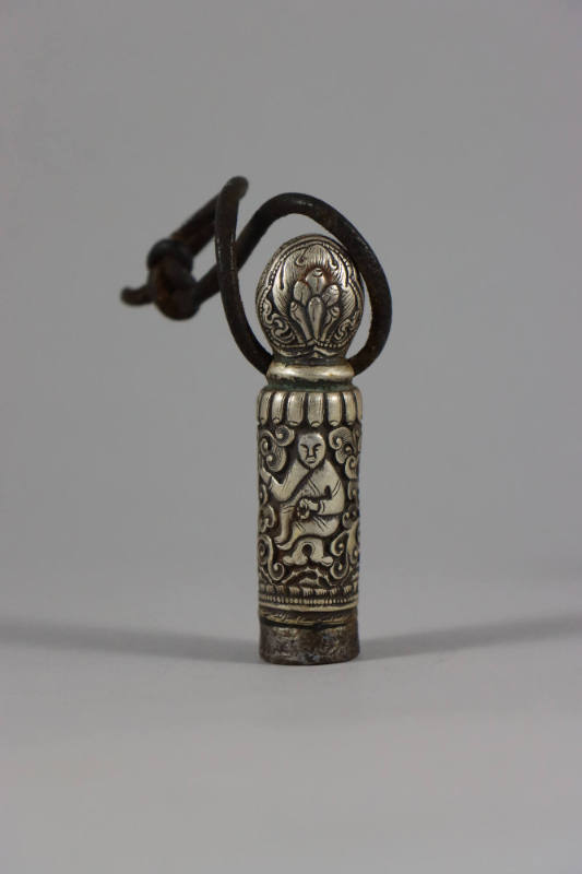 Seal, 19th to 20th Century
Tibet Autonomous Region
Silver and leather; 2 5/8 × 5/8 × 5/8 in.
…