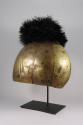 Helmet, 20th Century
Otuho culture; South Sudan
Human hair, clay, brass and ostrich feather; …