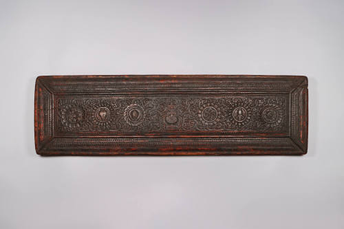 Sutra Cover, 19th Century
Tibet Autonomous Region
Wood; 8 3/4 × 29 3/4 × 1 7/8 in.
2021.8.32…