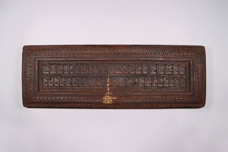 Sutra Cover, 19th Century
Tibet Autonomous Region
Wood; 9 1/2 × 27 1/2 × 1 1/4 in.
2021.8.35…