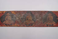 Sutra Cover, 19th Century
Tibet Autonomous Region
Wood and paint; 4 3/4 × 23 5/8 × 7/8 in.
2…