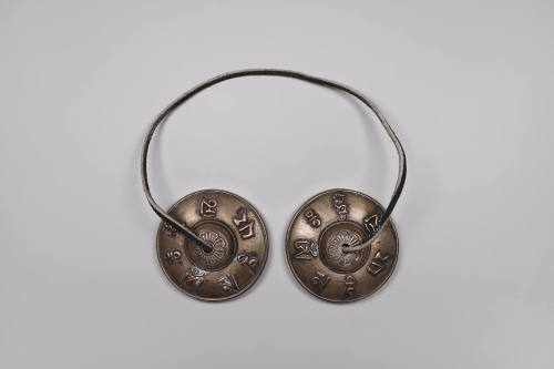 Prayer Cymbals (Ting-shags), 20th Century
Tibet Autonomous Region
Silver and leather; 1 × 2 1…