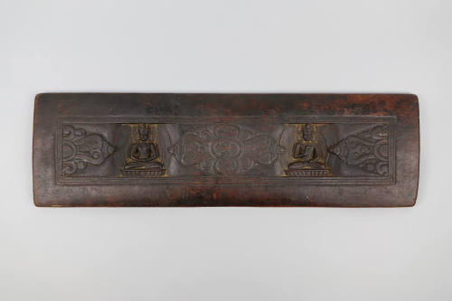 Sutra Cover, 19th Century
Tibet Autonomous Region
Wood; 8 × 26 7/8 × 7/8 in.
2021.8.41
Gift…