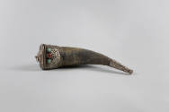 Powder Horn, 19th Century
Tibet Autonomous Region
Horn, silver, turquoise and coral; 10 3/8 ×…