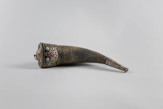 Powder Horn, 19th Century
Tibet Autonomous Region
Horn, silver, turquoise and coral; 10 3/8 ×…
