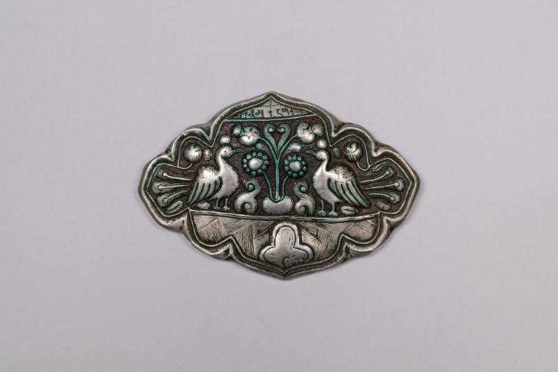Apron Clasp, 19th to 20th Century
Shigatse, Tibet Autonomous Region, China
Silver; 3 1/2 × 5 …